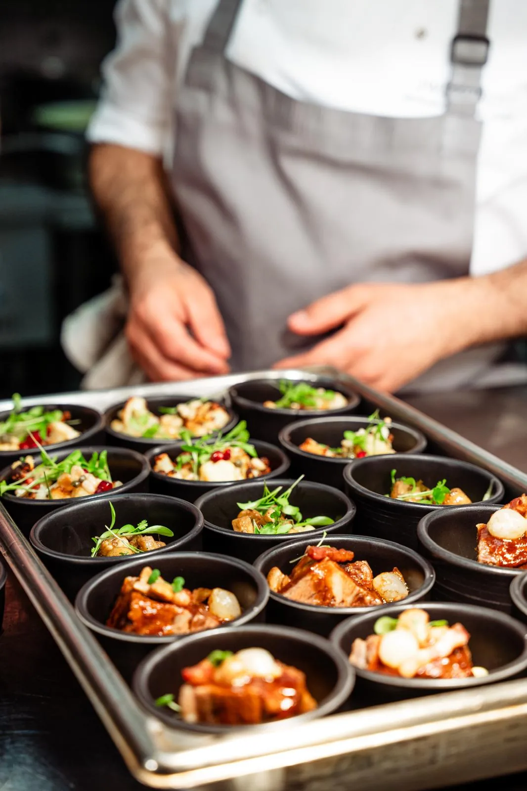 Chef preparing individual savoury courses for private service